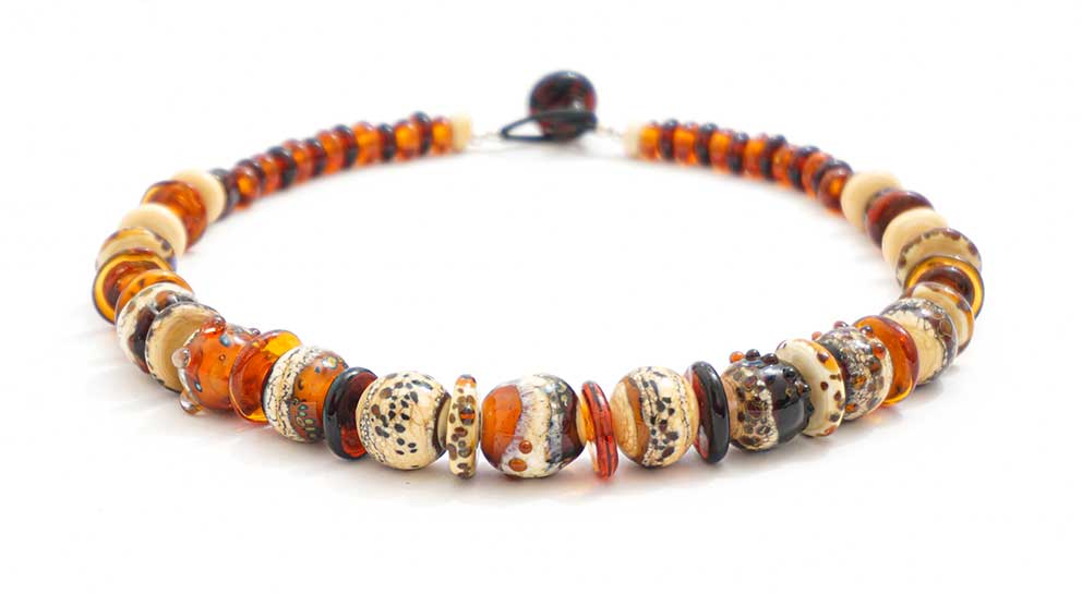 Annie McCabe at her lampwork torch, shaping molten glass