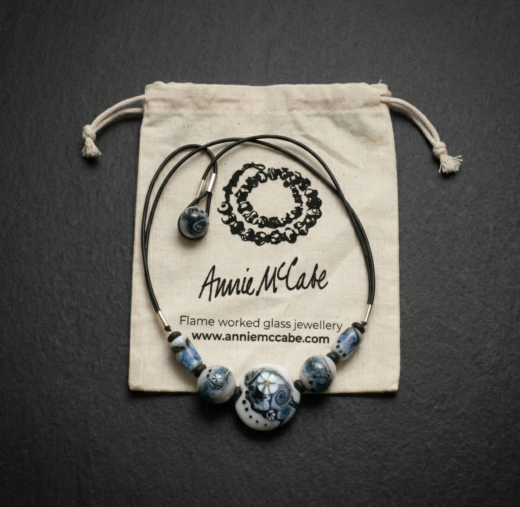 Annie McCabe at her lampwork torch, shaping molten glass